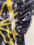 Girls space themed skater dress with ruffle cap sleeves. Black-white star print with golden geometric graphic, flared swing skirt, ideal for galaxy party, Halloween and themed cosplay dress-up.