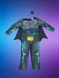 Boys dark hero jumpsuit costume set with cape and eye mask. Simulated muscle print and bat emblem design. Ideal for Halloween, themed parties, school dress-up and kids superhero role-play activities.