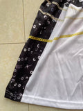 Girls space themed skater dress with ruffle cap sleeves. Black-white star print with golden geometric graphic, flared swing skirt, ideal for galaxy party, Halloween and themed cosplay dress-up.