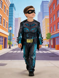 Boys dark hero jumpsuit costume set with cape and eye mask. Simulated muscle print and bat emblem design. Ideal for Halloween, themed parties, school dress-up and kids superhero role-play activities.
