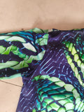 Kids reptile scale print jumpsuit, mock neck long sleeve full-length one-piece costume. Green gradient snake skin pattern, stretch slim fit, suitable for dinosaur reptile themed cosplay and Halloween dress-up.