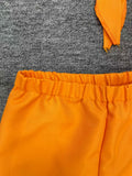 Kids orange inmate costume set includes knotted short-sleeve shirt and elastic cuff long pants. Printed letter details, great for Halloween parties, themed role-play and carnival dress-up.