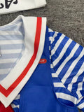 Girls' Nautical 4pcs Set Includes a Blue Striped Top, Vest, Blue Shorts, And a White Printed Hat. Features Classic Blue And White Sailor Stripes with a Red Bow Accent. The Vest And Headband Design Enhance The Uniform'S Professional Look