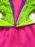 Girls whimsy mad hatter costume set includes long sleeve jacket, pink tutu skirt and mini top hat headband. Vibrant colorful design, ideal for Halloween, tea party theme and fantasy role-play activities.
