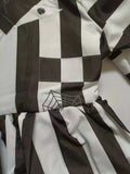 Girls black and white striped long sleeve dress with mock collar. Unique faux vest stitching design and pleated skirt. Suitable for casual daily wear, photo shoots, themed parties and creative dress-up occasions.
