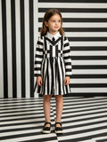 Girls black and white striped long sleeve dress with mock collar. Unique faux vest stitching design and pleated skirt. Suitable for casual daily wear, photo shoots, themed parties and creative dress-up occasions.