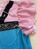 Girls fantasy adventure cosplay dress with ruffle cap sleeves. Faux zipper & buckle print bodice, color block geometric skirt, bright multi-color design for magic forest themed party and dress-up events.