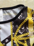 Girls space themed skater dress with ruffle cap sleeves. Black-white star print with golden geometric graphic, flared swing skirt, ideal for galaxy party, Halloween and themed cosplay dress-up.