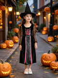 Girls pink trim witch costume set includes long dress and lace decorated witch hat. Sheer mesh sleeves and crisscross corset front. Ideal for Halloween, witch themed parties and kids fantasy role-play activities.