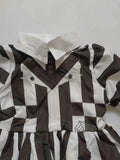 Girls black and white striped long sleeve dress with mock collar. Unique faux vest stitching design and pleated skirt. Suitable for casual daily wear, photo shoots, themed parties and creative dress-up occasions.