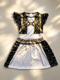 Girls space themed skater dress with ruffle cap sleeves. Black-white star print with golden geometric graphic, flared swing skirt, ideal for galaxy party, Halloween and themed cosplay dress-up.