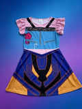 Girls fantasy adventure cosplay dress with ruffle cap sleeves. Faux zipper & buckle print bodice, color block geometric skirt, bright multi-color design for magic forest themed party and dress-up events.
