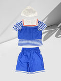 Girls' Nautical 4pcs Set Includes a Blue Striped Top, Vest, Blue Shorts, And a White Printed Hat. Features Classic Blue And White Sailor Stripes with a Red Bow Accent. The Vest And Headband Design Enhance The Uniform'S Professional Look